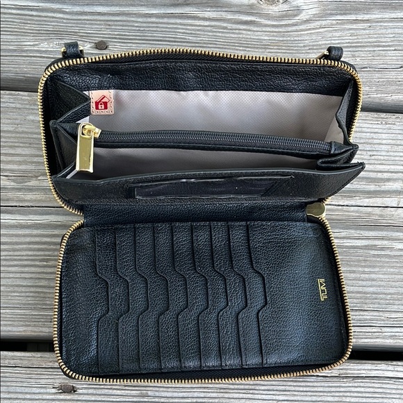 Tumi Black and Gold Pebbled Leather Wristlet